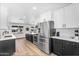 Spacious kitchen with white cabinets and stainless steel refrigerator at 14635 N 37Th Pl, Phoenix, AZ 85032