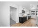This renovated kitchen features modern black and white cabinets and new stainless appliances at 14635 N 37Th Pl, Phoenix, AZ 85032