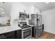 A contemporary kitchen is featured with stainless steel appliances and sleek countertops at 14635 N 37Th Pl, Phoenix, AZ 85032