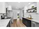 Bright kitchen with open shelving and stainless steel appliances at 14635 N 37Th Pl, Phoenix, AZ 85032