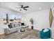 Bright living room with large windows, comfortable seating, and a modern aesthetic, perfect for relaxing and entertaining at 14635 N 37Th Pl, Phoenix, AZ 85032
