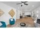 Open concept living and dining area with hardwood floors, chic decor, and an inviting atmosphere at 14635 N 37Th Pl, Phoenix, AZ 85032