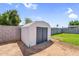A backyard shed offering ample storage space and a secure place for your equipment at 14635 N 37Th Pl, Phoenix, AZ 85032