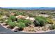 Aerial view of desert home with mountain views and native landscaping at 14760 E Paradise Dr, Fountain Hills, AZ 85268