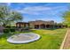 Expansive backyard features a trampoline, pergola, mature trees, and views of home at 14760 E Paradise Dr, Fountain Hills, AZ 85268