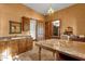 Spacious dressing room featuring custom wood cabinets, granite counters, and a center island at 14760 E Paradise Dr, Fountain Hills, AZ 85268