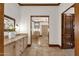 Bathroom featuring tan cabinets, tile flooring and a decorative doorway at 14760 E Paradise Dr, Fountain Hills, AZ 85268