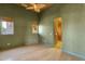 Spacious bedroom featuring wood floors, two windows and a modern ceiling fan at 14760 E Paradise Dr, Fountain Hills, AZ 85268