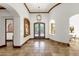 Elegant foyer with travertine flooring, wood beam accents, and decorative lighting at 14760 E Paradise Dr, Fountain Hills, AZ 85268