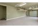 Bright garage space with epoxy flooring and overhead storage at 14760 E Paradise Dr, Fountain Hills, AZ 85268