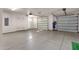 Spacious three-car garage featuring epoxy floors and storage at 14760 E Paradise Dr, Fountain Hills, AZ 85268