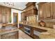 Gourmet kitchen features granite countertops, custom cabinets, and stainless steel appliances at 14760 E Paradise Dr, Fountain Hills, AZ 85268