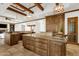 Spacious kitchen with granite countertops, stone tile floor, and custom wood cabinetry at 14760 E Paradise Dr, Fountain Hills, AZ 85268