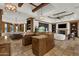 Large kitchen with multiple cooking and eating spaces, along with custom wood cabinets at 14760 E Paradise Dr, Fountain Hills, AZ 85268