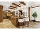 Luxurious kitchen features wood beams, a breakfast bar, and stone tile flooring at 14760 E Paradise Dr, Fountain Hills, AZ 85268