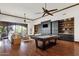 Entertainment room with a pool table, large television, and custom wood cabinets at 14760 E Paradise Dr, Fountain Hills, AZ 85268