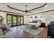 Spacious main bedroom featuring hardwood floors, lots of natural light, and tray ceilings at 14760 E Paradise Dr, Fountain Hills, AZ 85268