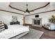 Comfortable main bedroom featuring a fireplace, hardwood floors, and a decorative ceiling at 14760 E Paradise Dr, Fountain Hills, AZ 85268