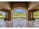 Covered patio supported by grand columns overlooking a well-manicured lawn at 14760 E Paradise Dr, Fountain Hills, AZ 85268