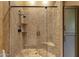 Modern bathroom boasts an tiled shower with glass door and matte black fixtures at 14760 E Paradise Dr, Fountain Hills, AZ 85268