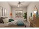 Serene bedroom with stylish decor, cozy bed, and abundant natural light at 16222 W Augusta Ave, Litchfield Park, AZ 85340