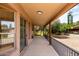 Covered patio with access to horse property offers shade, views, and space for relaxation and enjoying the outdoors at 16222 W Augusta Ave, Litchfield Park, AZ 85340