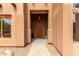 Charming entryway featuring a solid wood door and neutral decor that creates a welcoming first impression at 16222 W Augusta Ave, Litchfield Park, AZ 85340