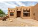Inviting Southwestern-style home with a meticulously xeriscaped front yard, enhancing curb appeal at 16222 W Augusta Ave, Litchfield Park, AZ 85340