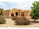 Well-maintained home featuring Southwestern architecture, gravel landscaping, and appealing outdoor aesthetics at 16222 W Augusta Ave, Litchfield Park, AZ 85340