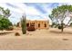 Charming tan home featuring desert landscaping, blue skies, and a welcoming ambiance at 16222 W Augusta Ave, Litchfield Park, AZ 85340
