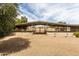 Large horse shelter with stalls providing shade and protection for horses on the property at 16222 W Augusta Ave, Litchfield Park, AZ 85340