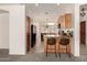 Modern kitchen area with granite counters, wood cabinets and tile flooring perfect for cooking and entertaining at 16222 W Augusta Ave, Litchfield Park, AZ 85340