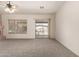 Comfortable living room area with a fireplace and sliding glass door, creating a seamless indoor-outdoor flow at 16222 W Augusta Ave, Litchfield Park, AZ 85340