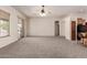 Bright and airy living room, perfect for entertaining with easy access to the kitchen and outdoor patio at 16222 W Augusta Ave, Litchfield Park, AZ 85340