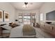 Inviting bedroom with neutral tones and a private outdoor view at 16222 W Augusta Ave, Litchfield Park, AZ 85340