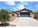 Charming single-story home with a well-maintained yard and attached two-car garage at 16418 W Whitehorn Way, Surprise, AZ 85387