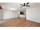 Inviting living room featuring hardwood floors, chandelier, and open layout at 16418 W Whitehorn Way, Surprise, AZ 85387