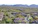 Scenic aerial view featuring the neighborhood, golf course, and desert landscape with a mountain backdrop at 19550 N Grayhawk Dr # 1039, Scottsdale, AZ 85255
