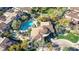 Stunning aerial view of estate with luxurious pool, lush landscaping, and unique architectural design at 19550 N Grayhawk Dr # 1039, Scottsdale, AZ 85255