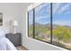 Bright bedroom features large window offering stunning desert mountain views at 19550 N Grayhawk Dr # 1039, Scottsdale, AZ 85255