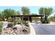 Gated community entrance with desert landscaping, providing security and a welcoming first impression at 19550 N Grayhawk Dr # 1039, Scottsdale, AZ 85255
