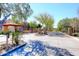 Well-maintained entrance with desert landscaping and gated access for enhanced security and privacy at 19550 N Grayhawk Dr # 1039, Scottsdale, AZ 85255