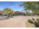 Gated community entrance with lush landscaping and desert plants at 19550 N Grayhawk Dr # 1039, Scottsdale, AZ 85255