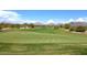 Expansive golf course with rolling green hills under a sunny, blue sky at 19550 N Grayhawk Dr # 1039, Scottsdale, AZ 85255