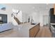 Bright, open kitchen features a large island, modern appliances, and seamless flow into the living and dining areas at 19550 N Grayhawk Dr # 1039, Scottsdale, AZ 85255