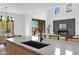 Well-designed kitchen area flowing into the dining and living spaces, accentuated by a modern island and fireplace at 19550 N Grayhawk Dr # 1039, Scottsdale, AZ 85255