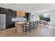 Modern kitchen featuring stone countertops, stainless steel appliances, and an open design with barstool seating at 19550 N Grayhawk Dr # 1039, Scottsdale, AZ 85255