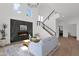 Living room features a modern fireplace, an open concept design, and a light-filled space with stairs to the next level at 19550 N Grayhawk Dr # 1039, Scottsdale, AZ 85255
