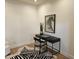 Minimalist office space with sleek black desk, zebra rug, and modern artwork at 19550 N Grayhawk Dr # 1039, Scottsdale, AZ 85255