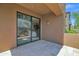 Covered patio with tile flooring, sliding glass doors lead to a spacious interior at 19550 N Grayhawk Dr # 1039, Scottsdale, AZ 85255